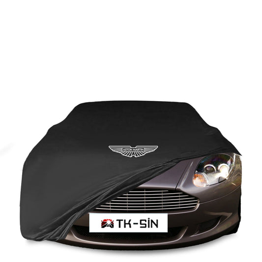 Aston Martin DB9 Coupe (2004–2012) mit maßgeschneiderter Indoor-Autoabdeckung in einer Garage in Deutschland