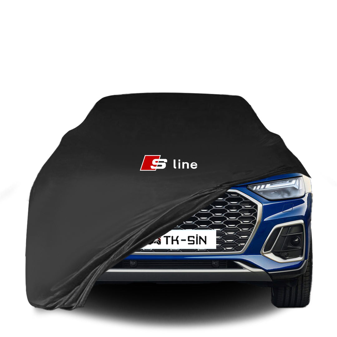 Audi Q5 SUV mit maßgeschneiderter Indoor-Autoabdeckung in einer Garage in Deutschland